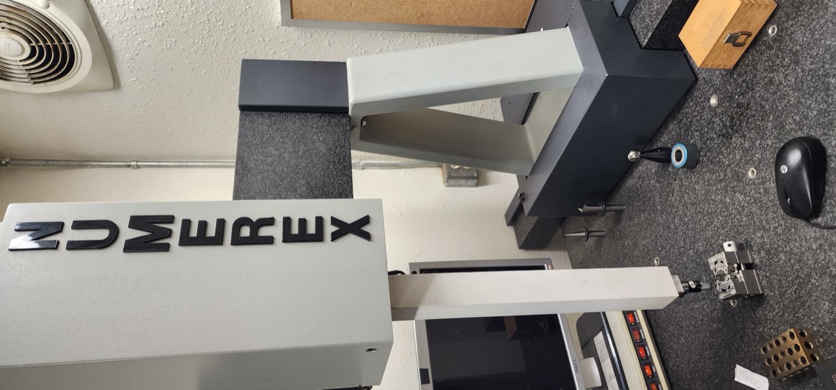Numerex CMM coordinate measuring machine performing dimensional inspection